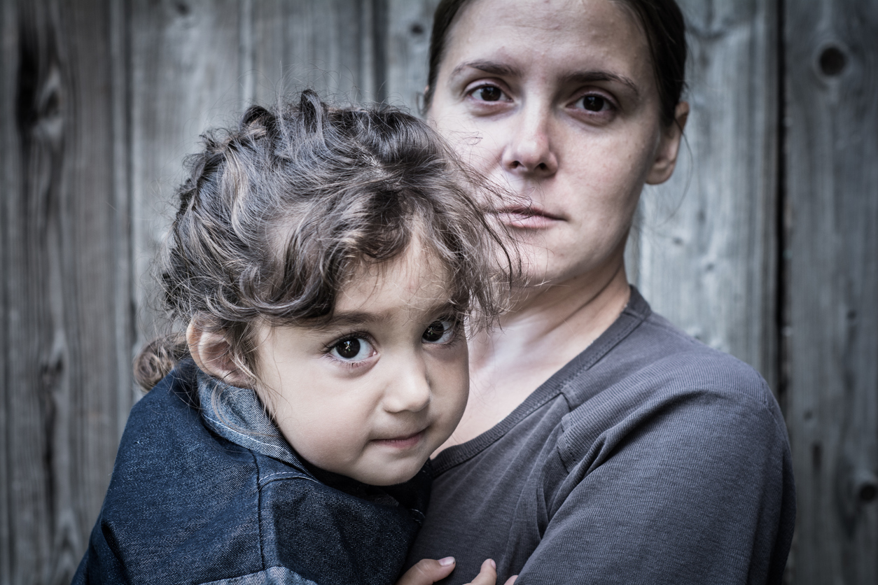 Mother holding child — documentary portrait